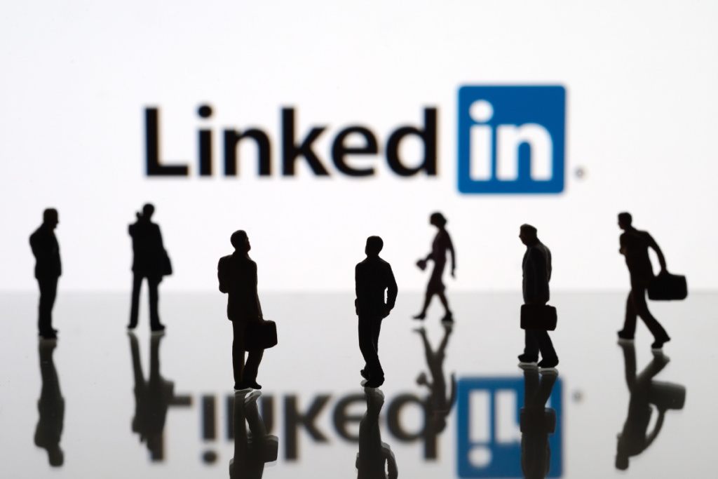 Silhouettes of men and women with LinkedIn logo